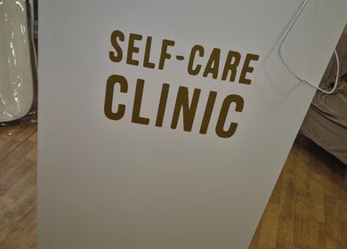Self Care Clinic signage at Porth, Wales, GB. Welcoming entry point to wellness services.