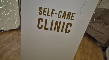 Self Care Clinic signage at Porth, Wales, GB. Welcoming entry point to wellness services.