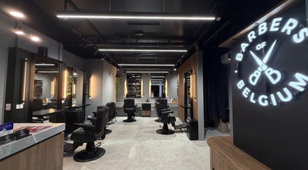 Modern interior of Barbers Of Belgium Pty Ltd. in Southport, QLD, AU, showcasing sleek barber chairs and decor.