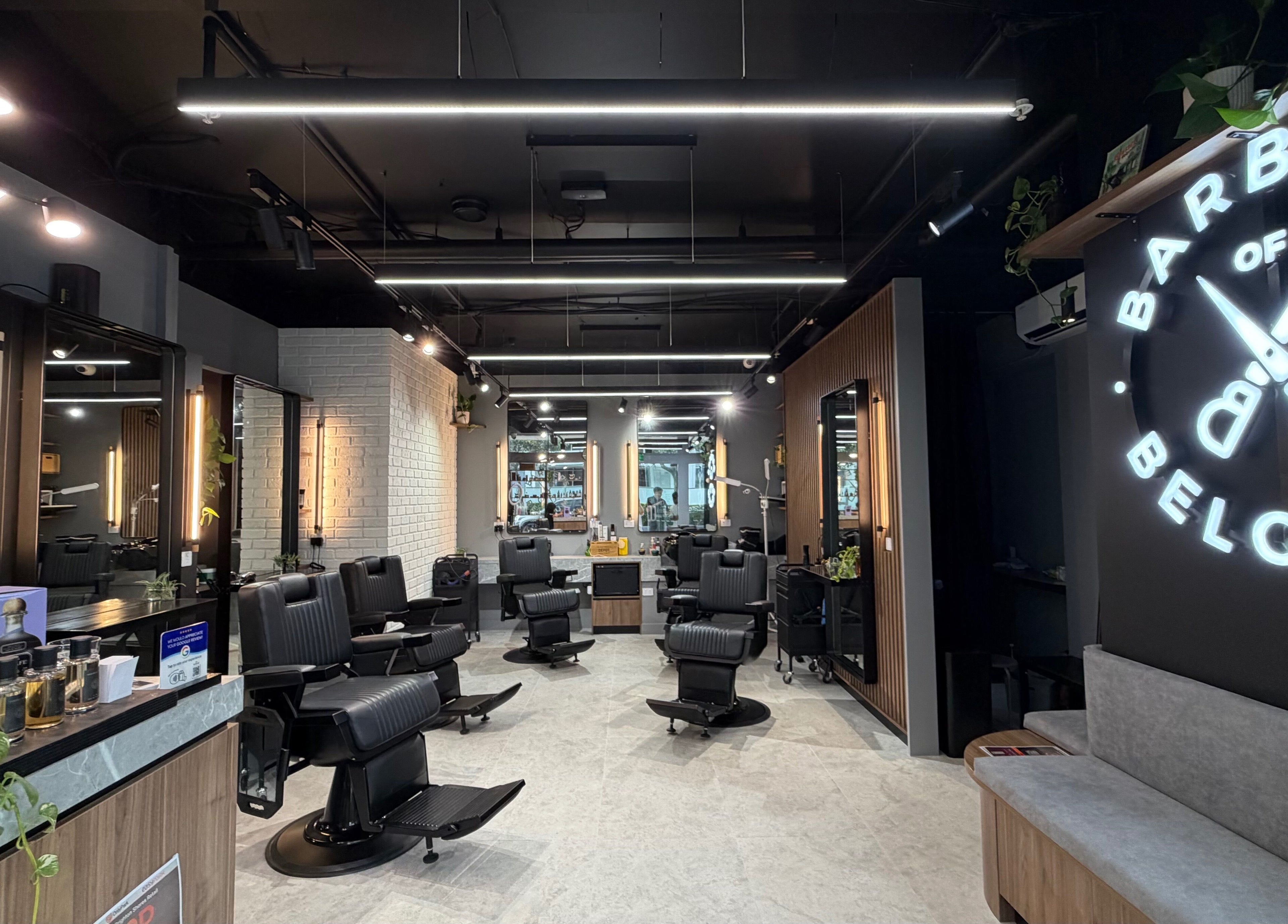 Modern interior of Barbers Of Belgium Pty Ltd. in Southport, QLD, AU featuring sleek black chairs.