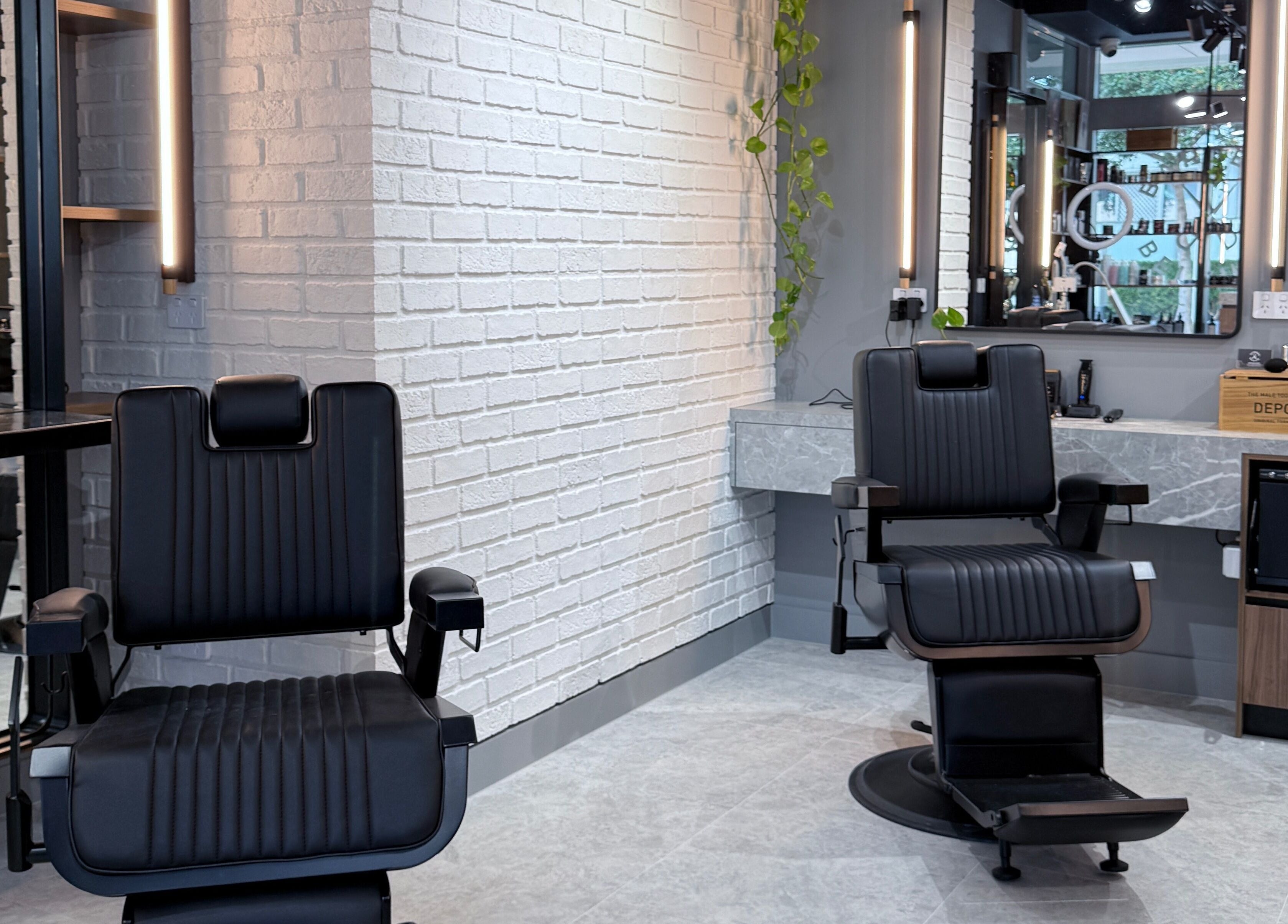 Modern barber chairs at Barbers Of Belgium Pty Ltd., Southport, QLD, AU, offering top grooming services.