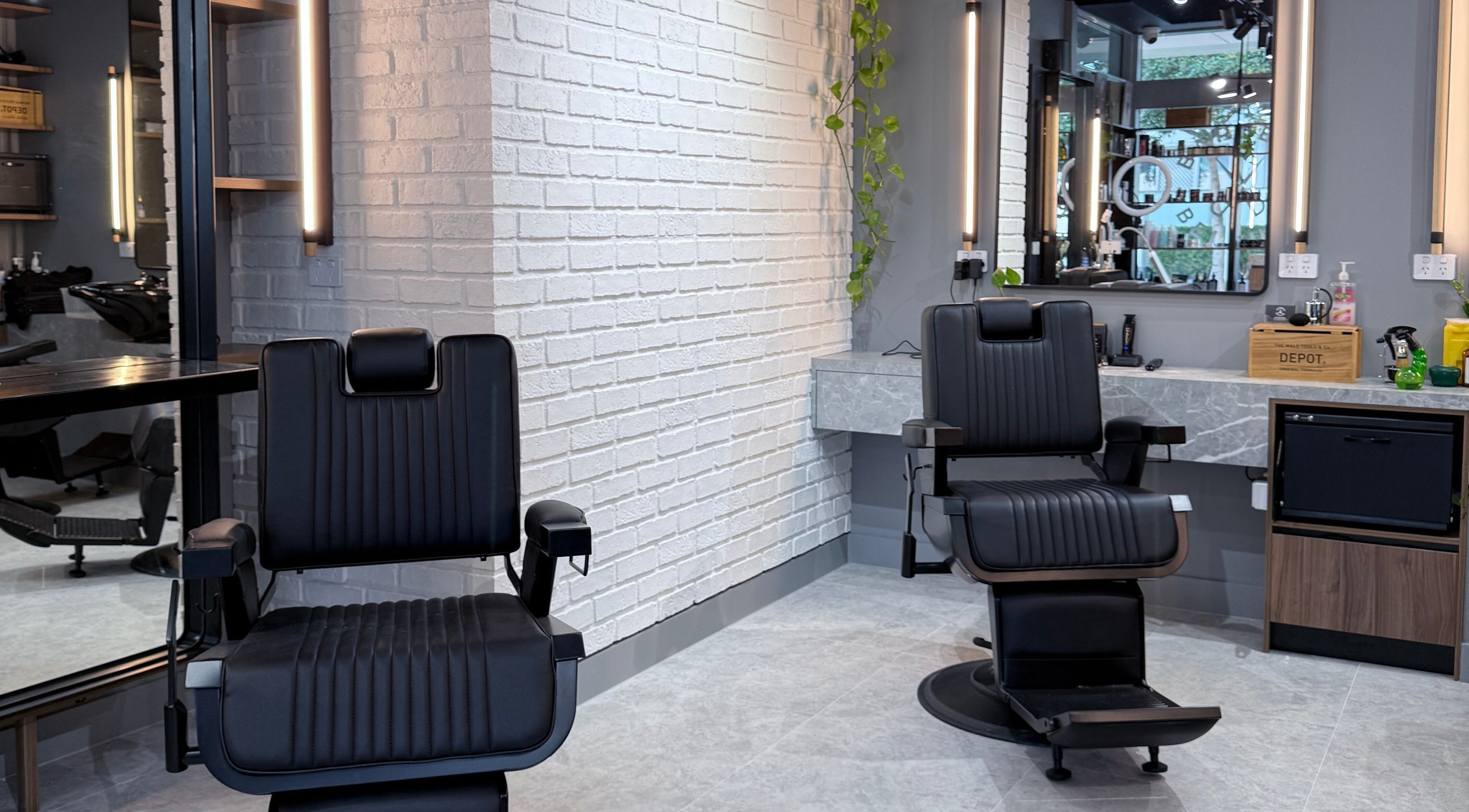 Modern barber chairs at Barbers Of Belgium Pty Ltd., Southport, QLD, AU, offering top grooming services.