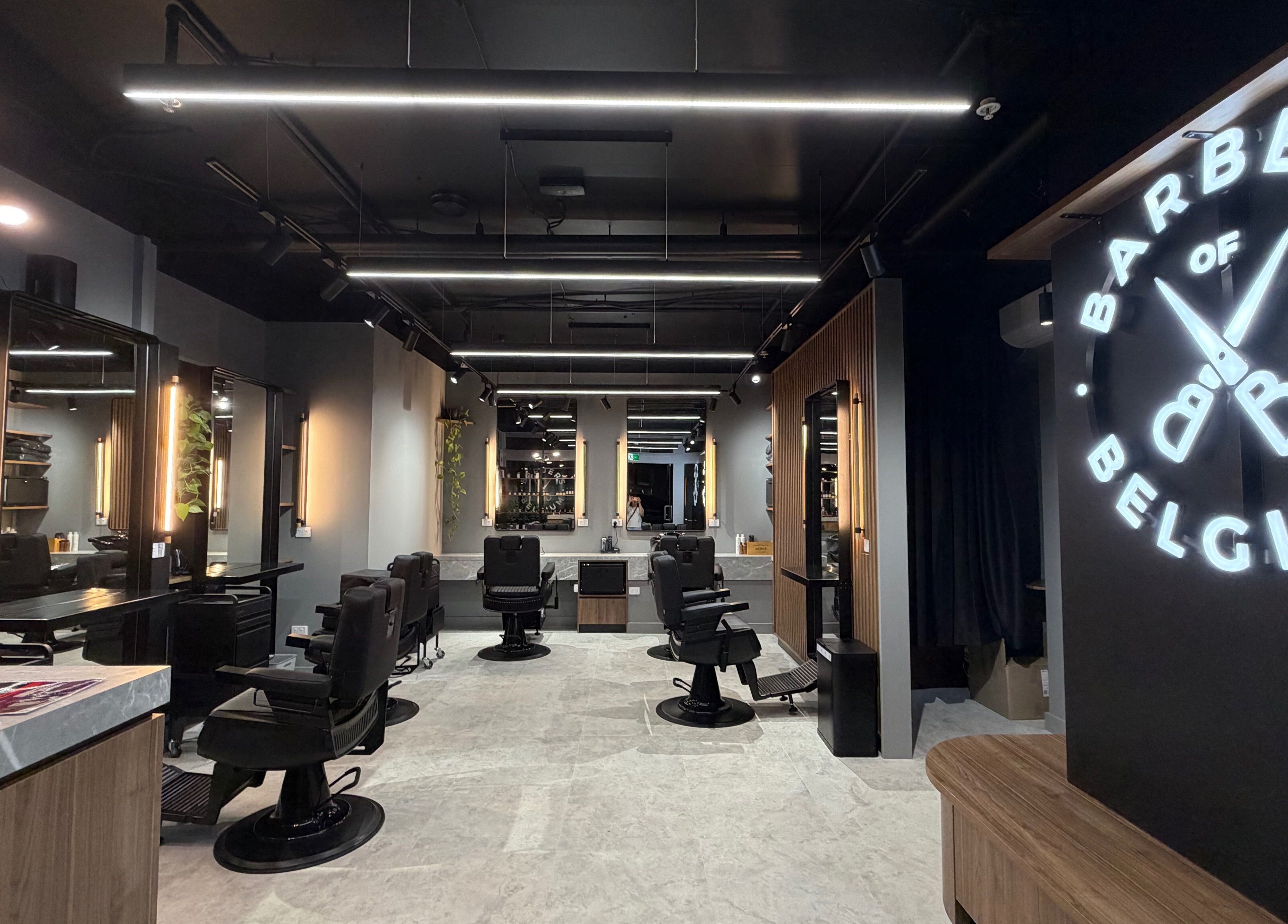 Sleek interior of Barbers Of Belgium Pty Ltd. in Southport, QLD, AU showcasing modern barber chairs and decor.
