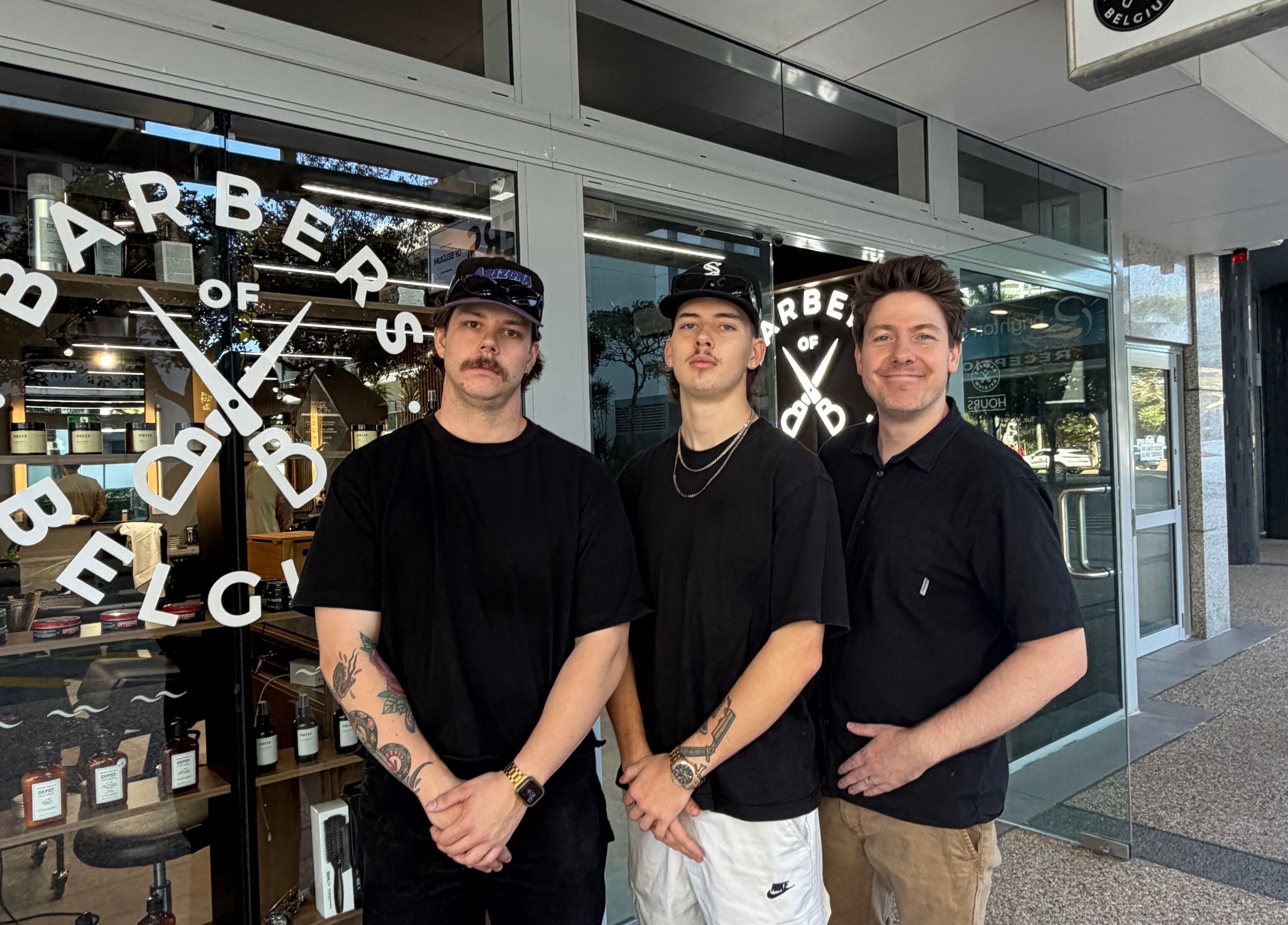 Team outside Barbers Of Belgium Pty Ltd, showcasing trendy styles in Southport, QLD, AU.