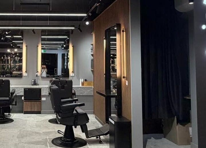 Modern interior of Barbers Of Belgium Pty Ltd., Southport, QLD, AU with stylish barber chairs and sleek design.
