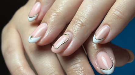 Elegant manicure with white and gold accents at Studio 65, Londonderry, Northern Ireland, GB.