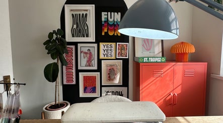 Cozy art-filled corner at Studio 65, Londonderry featuring vibrant decor and stylish furniture.