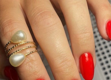 Elegant red manicure with stylish ring at S&M beauty and nails, Qawra, Malta, MT.