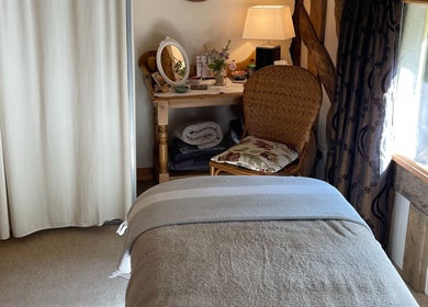 Peaceful treatment room at Ethical Boutique - Organic Skincare Studio in Bury St Edmunds, GB, featuring soft lighting.