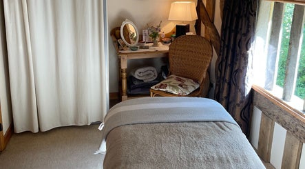 Peaceful treatment room at Ethical Boutique - Organic Skincare Studio in Bury St Edmunds, GB, featuring soft lighting.