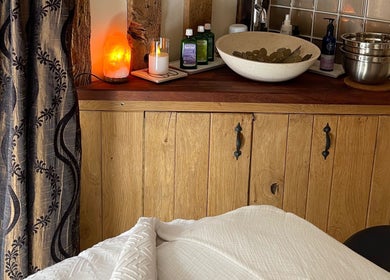 Relaxing treatment room at Ethical Boutique - Organic Skincare Studio in Bury St Edmunds, GB with warm decor.
