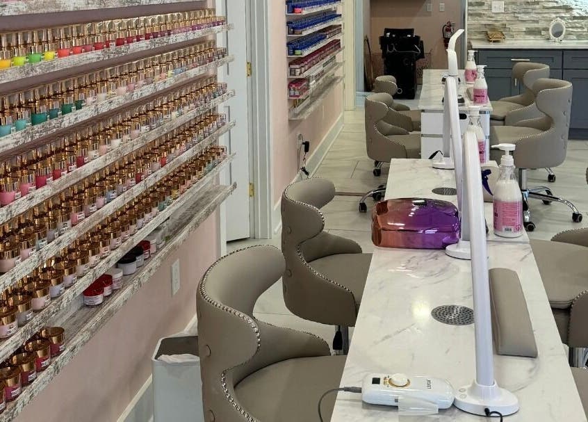 Dolce Lash Beauty Lounge nail station with colorful polishes in Washington Township, New Jersey, US.