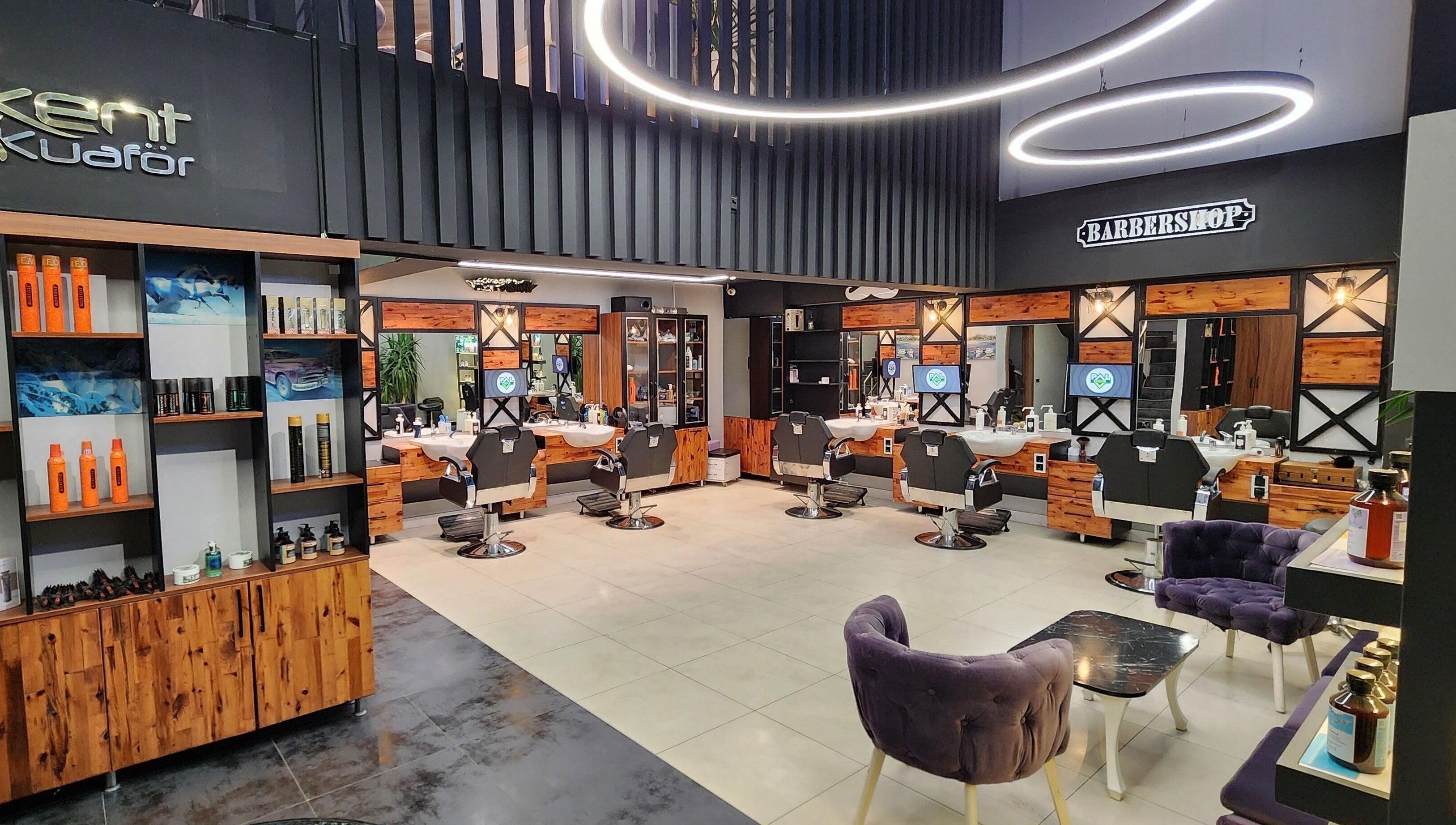 Interior of Alkent Erkek Kuafor in İstanbul, İstanbul, TR, showcasing stylish barber chairs and modern decor.