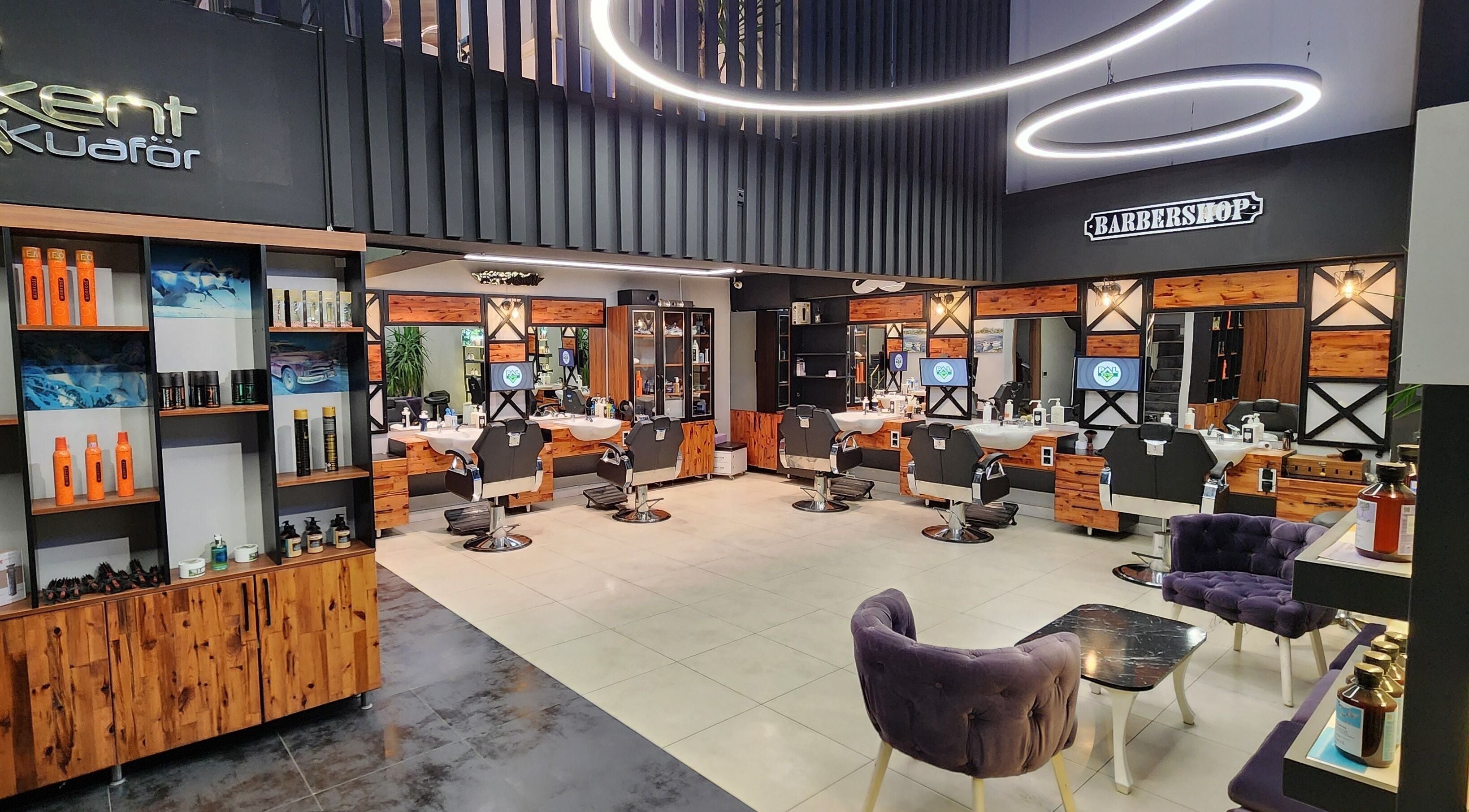 Interior of Alkent Erkek Kuafor in İstanbul, İstanbul, TR, showcasing stylish barber chairs and modern decor.