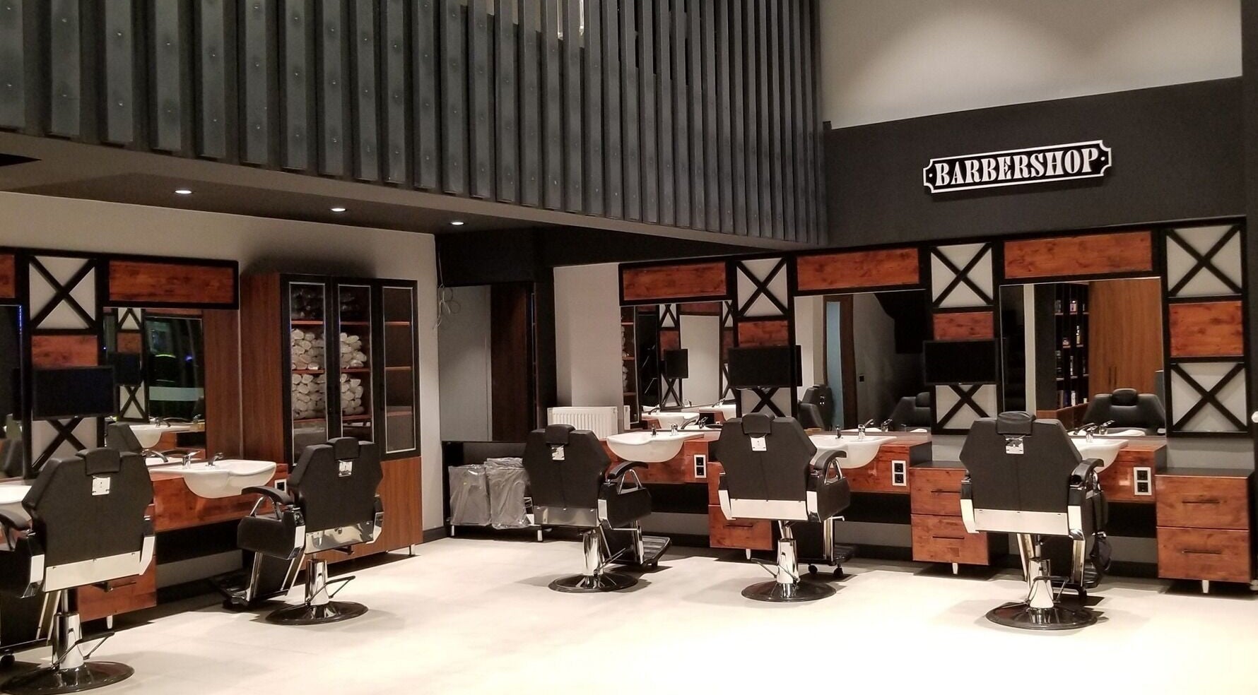 Modern and sleek interior at Alkent Erkek Kuafor in İstanbul, İstanbul, TR.