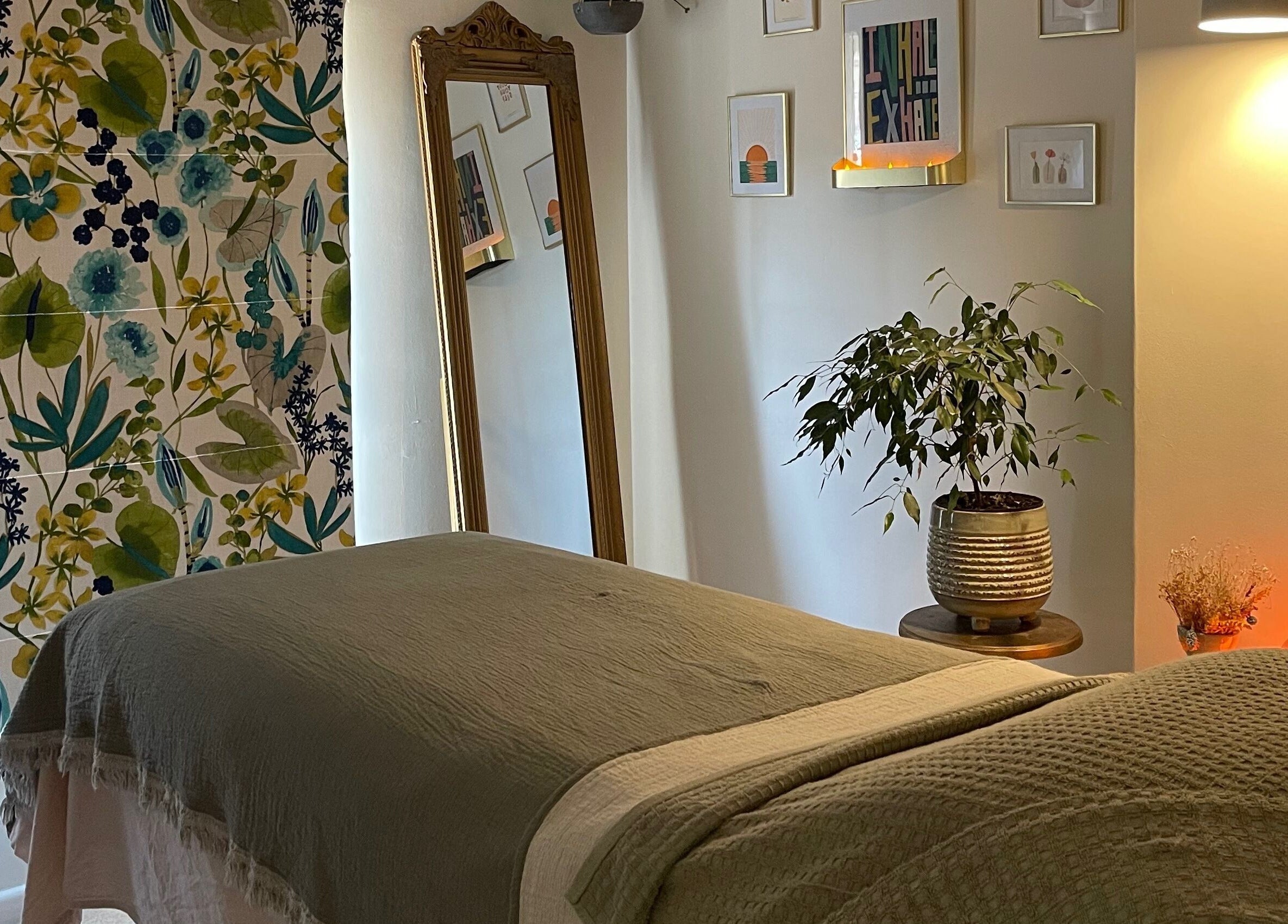 Relaxing treatment room at The Holistic Hideaway, Pott Row, England, GB, featuring calming decor and soft lighting.