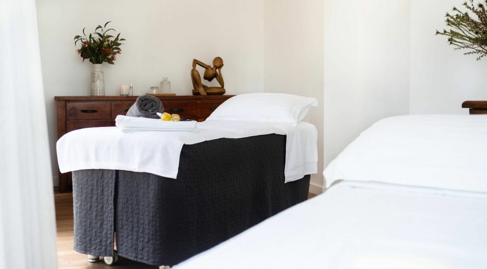 Tranquil treatment room at Chimes Day Spa, Denmark, Western Australia, AU. Features massage table and decor.