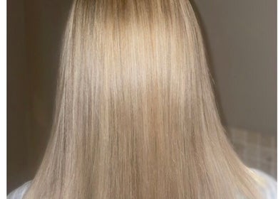 Smooth blonde hair styled at Scarletts Hair, Rochester, England, GB.