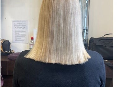 Sleek blonde bob hairstyle at Scarletts Hair, Rochester, England, GB, showcasing professional hairdressing.