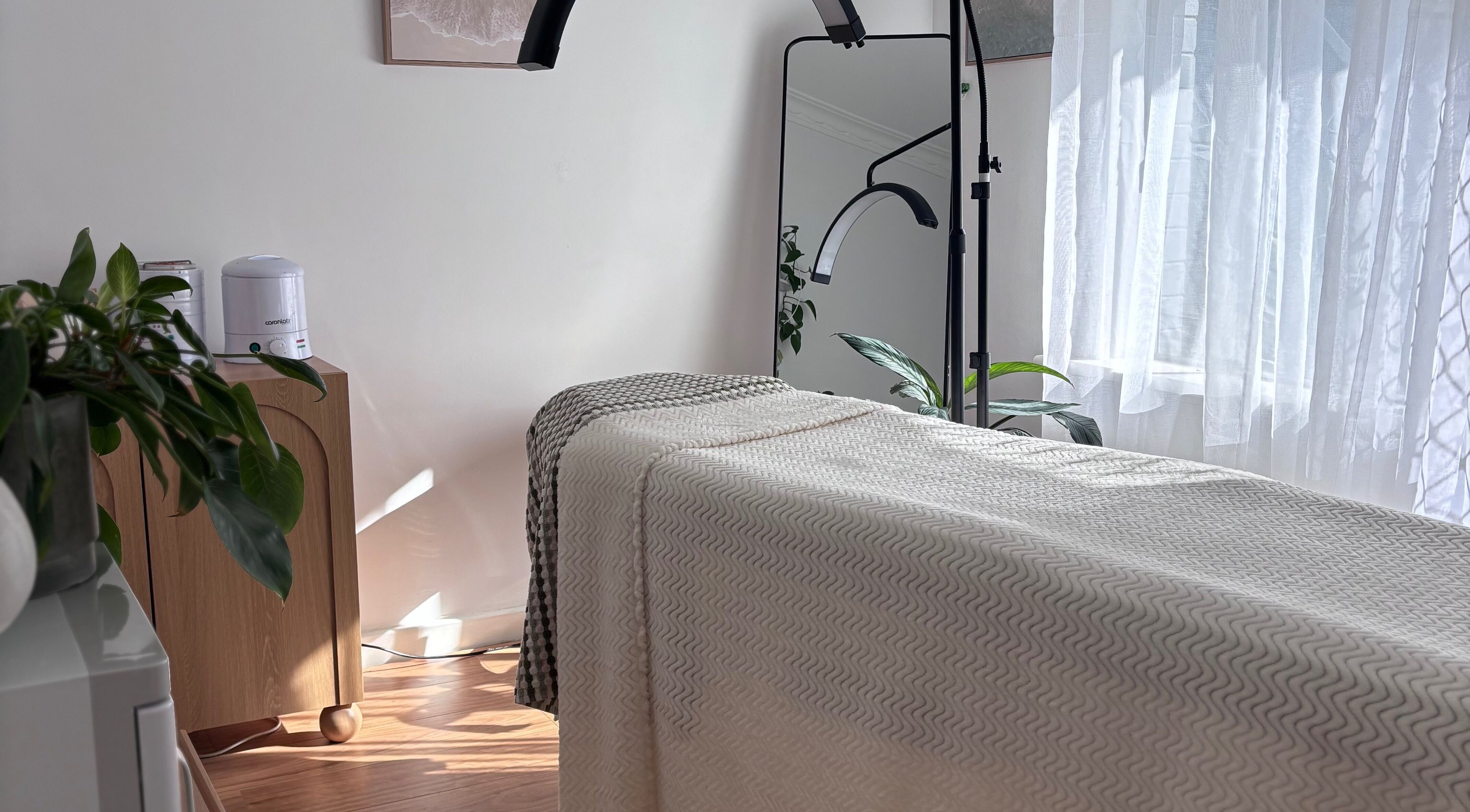 Massage room setup at Blooming Beauty Co, Mount Nasura, Western Australia, AU, featuring a serene and relaxing ambiance.