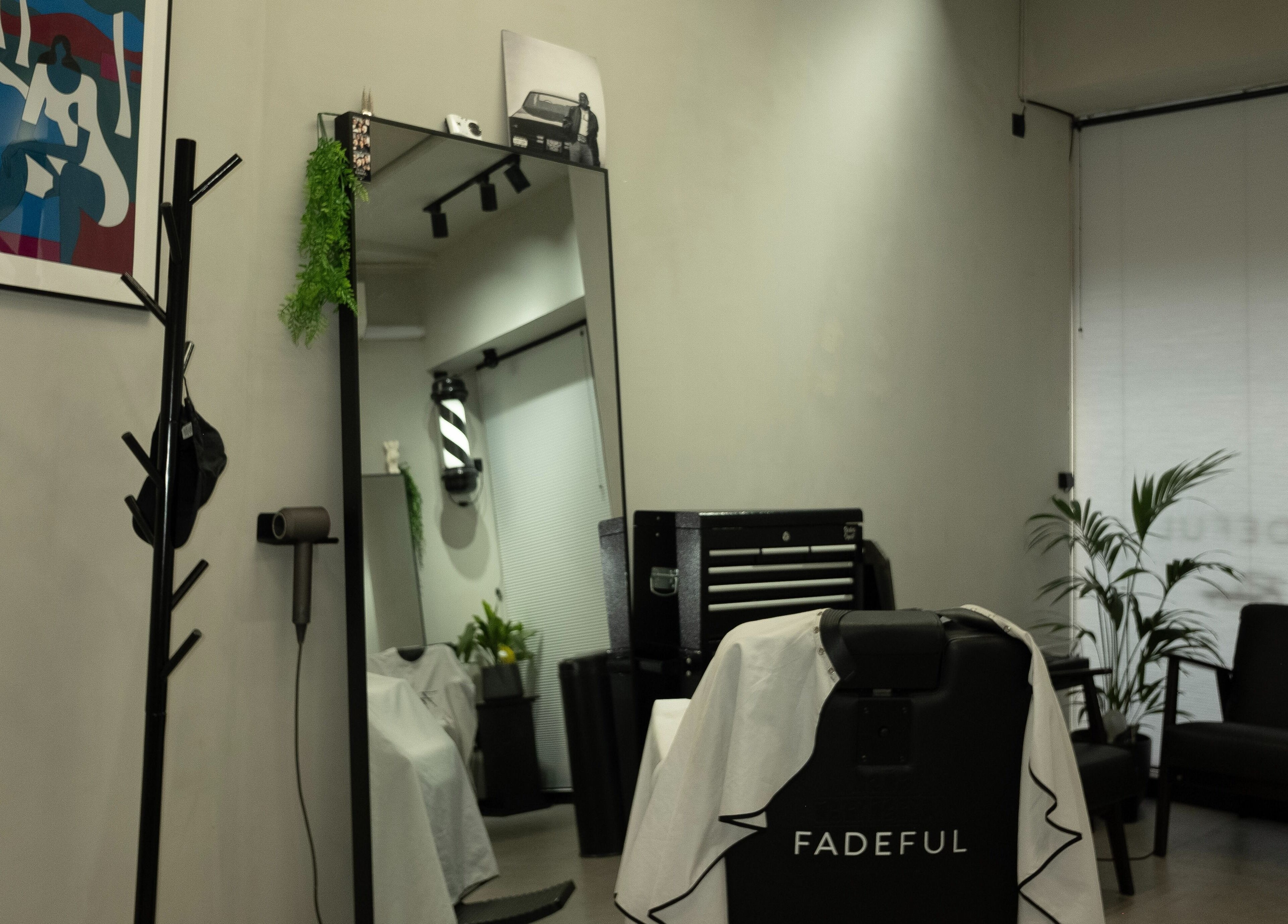 Interior of Fadeful Barbershop in Almere, Flevoland, NL with sleek design and barber chair.