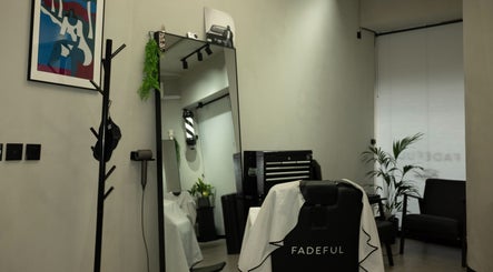 Interior of Fadeful Barbershop in Almere, Flevoland, NL with sleek design and barber chair.