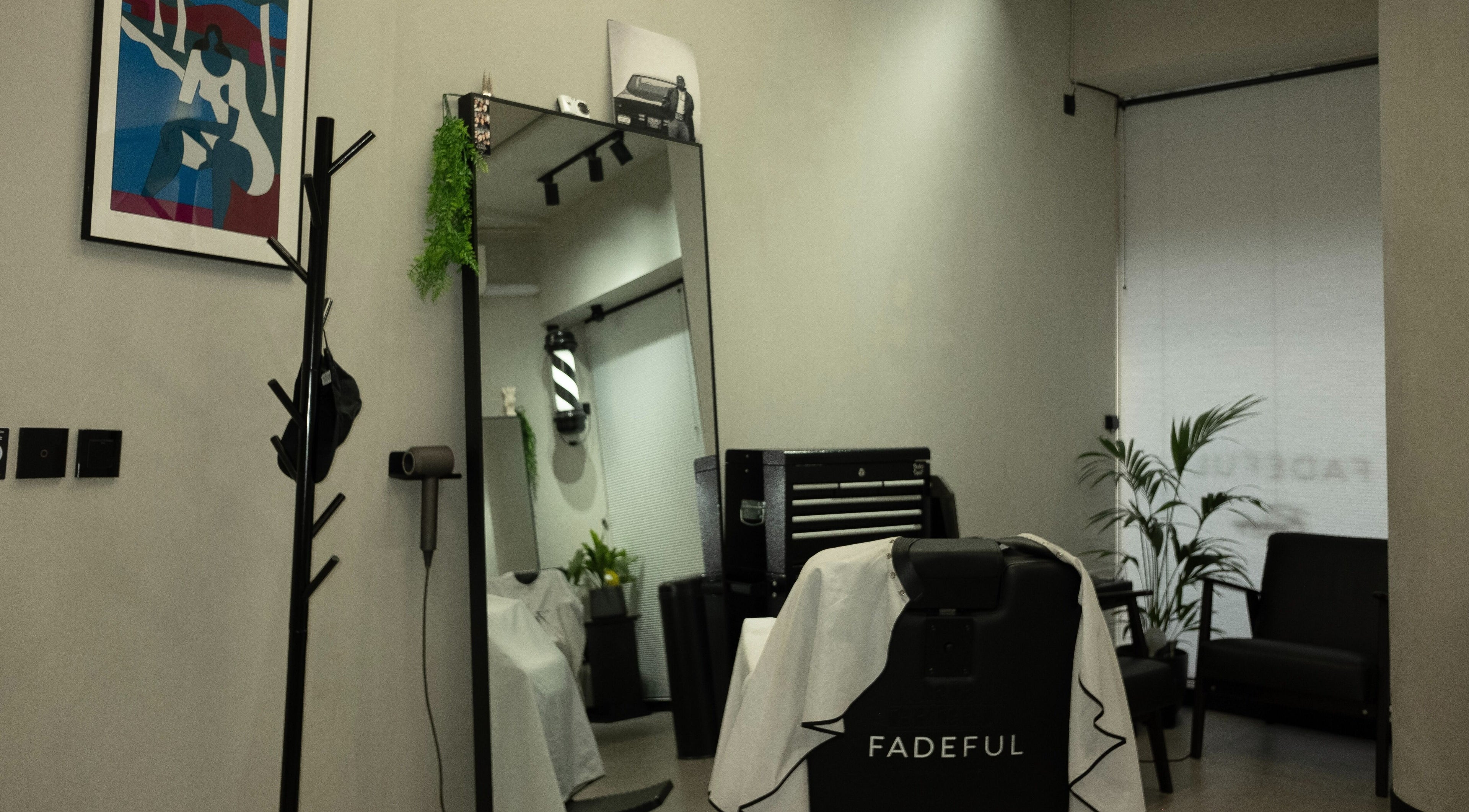 Interior of Fadeful Barbershop in Almere, Flevoland, NL with sleek design and barber chair.