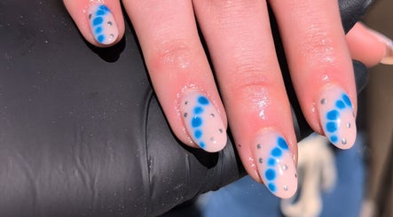 Stylish blue dotted nails design at Nics Nails, Shrewsbury, England, GB.
