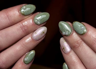 Stylish green and glittery nail art at Nics Nails in Shrewsbury, England, GB.