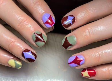 Colorful geometric nail art at Nics Nails, Shrewsbury, England, GB, showcasing intricate designs.