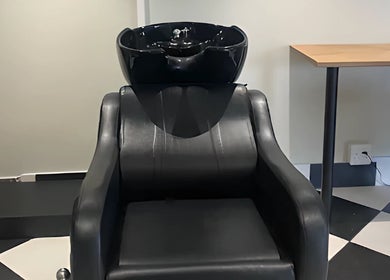 Luxurious hair wash chair at Hello Happiness Hair by Elrae, Cape Town, Western Cape, ZA for a stylish experience.