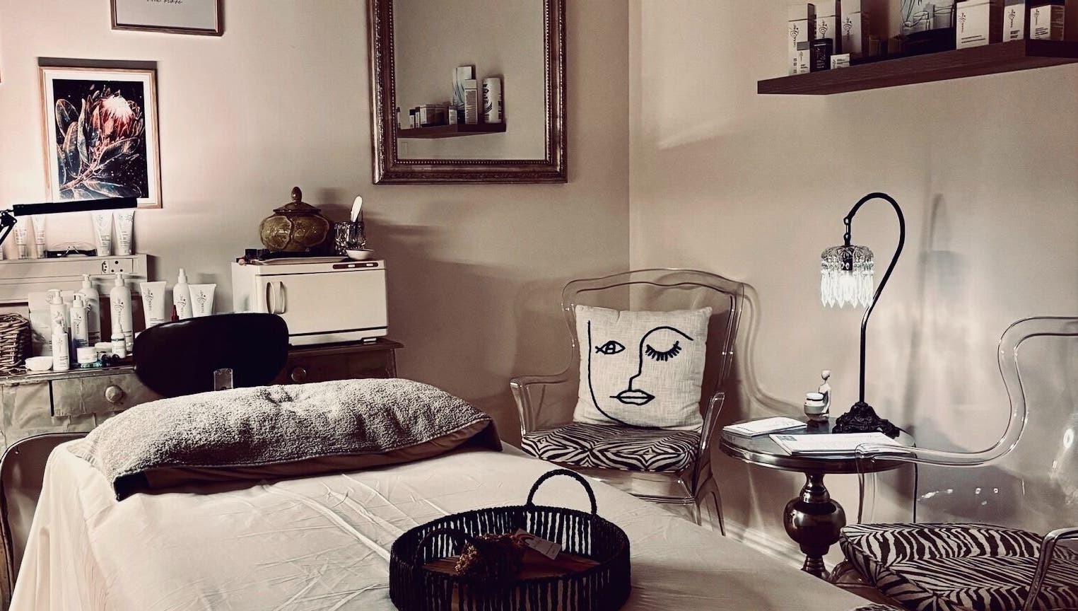 Tranquil treatment room at .Breathe Body & Skin, Dolphin Coast, Kwazulu-natal, ZA, featuring cozy decor and skincare products.