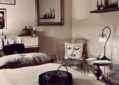 Tranquil treatment room at .Breathe Body & Skin, Dolphin Coast, Kwazulu-natal, ZA, featuring cozy decor and skincare products.