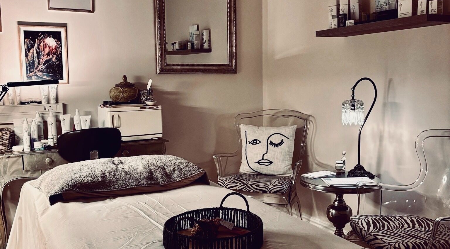 Tranquil treatment room at .Breathe Body & Skin, Dolphin Coast, Kwazulu-natal, ZA, featuring cozy decor and skincare products.