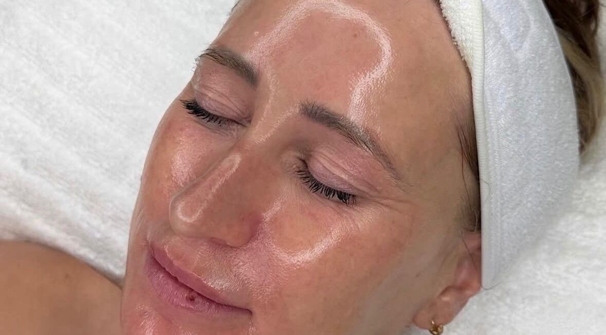 Client receiving a relaxing facial at Cove Skin Clinic, Rainham, England, GB, showcasing radiant skin.