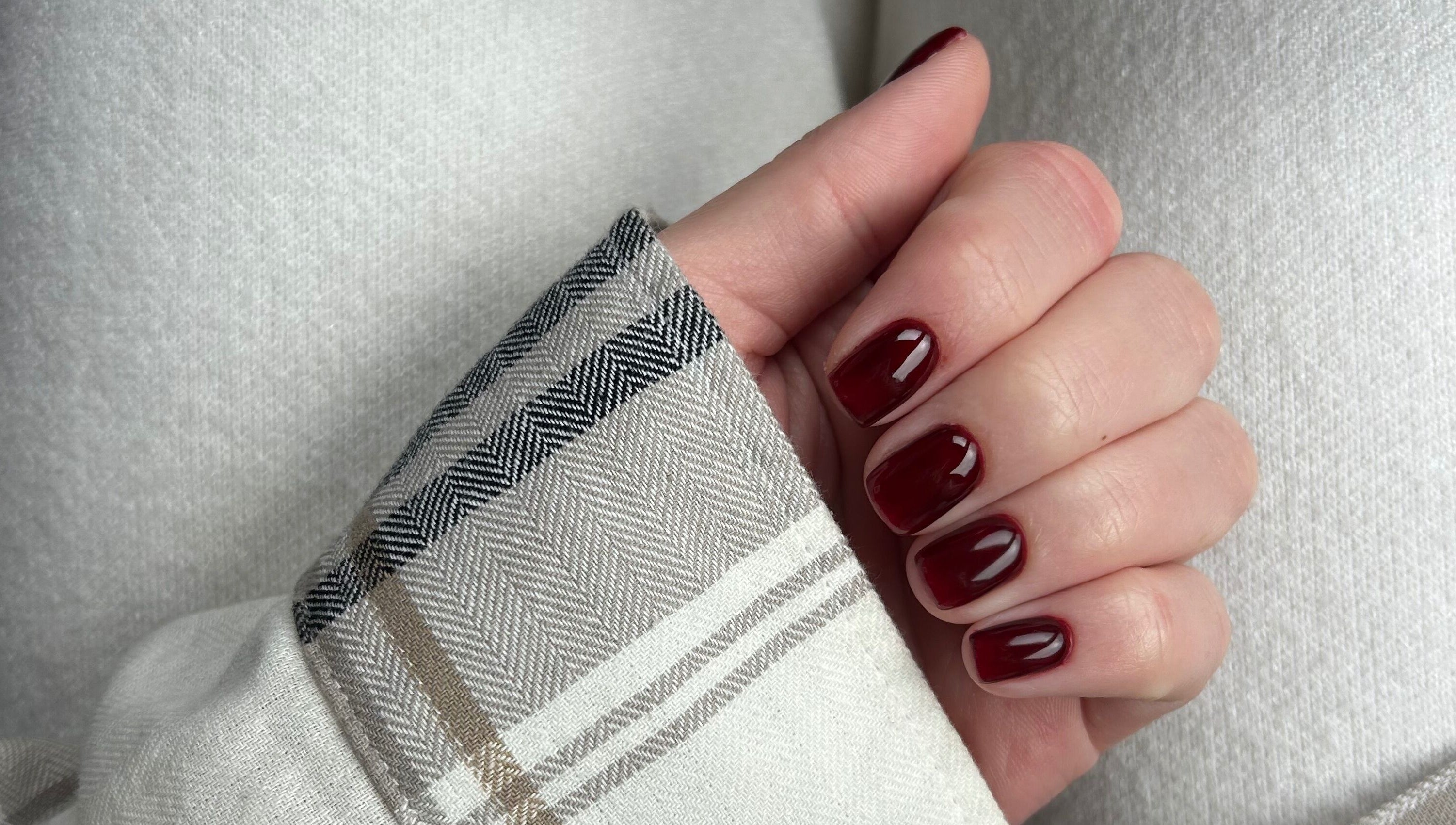 Deep red manicured nails at Manicured By Amelia in Cannock, England, GB. Elegant and stylish finish.