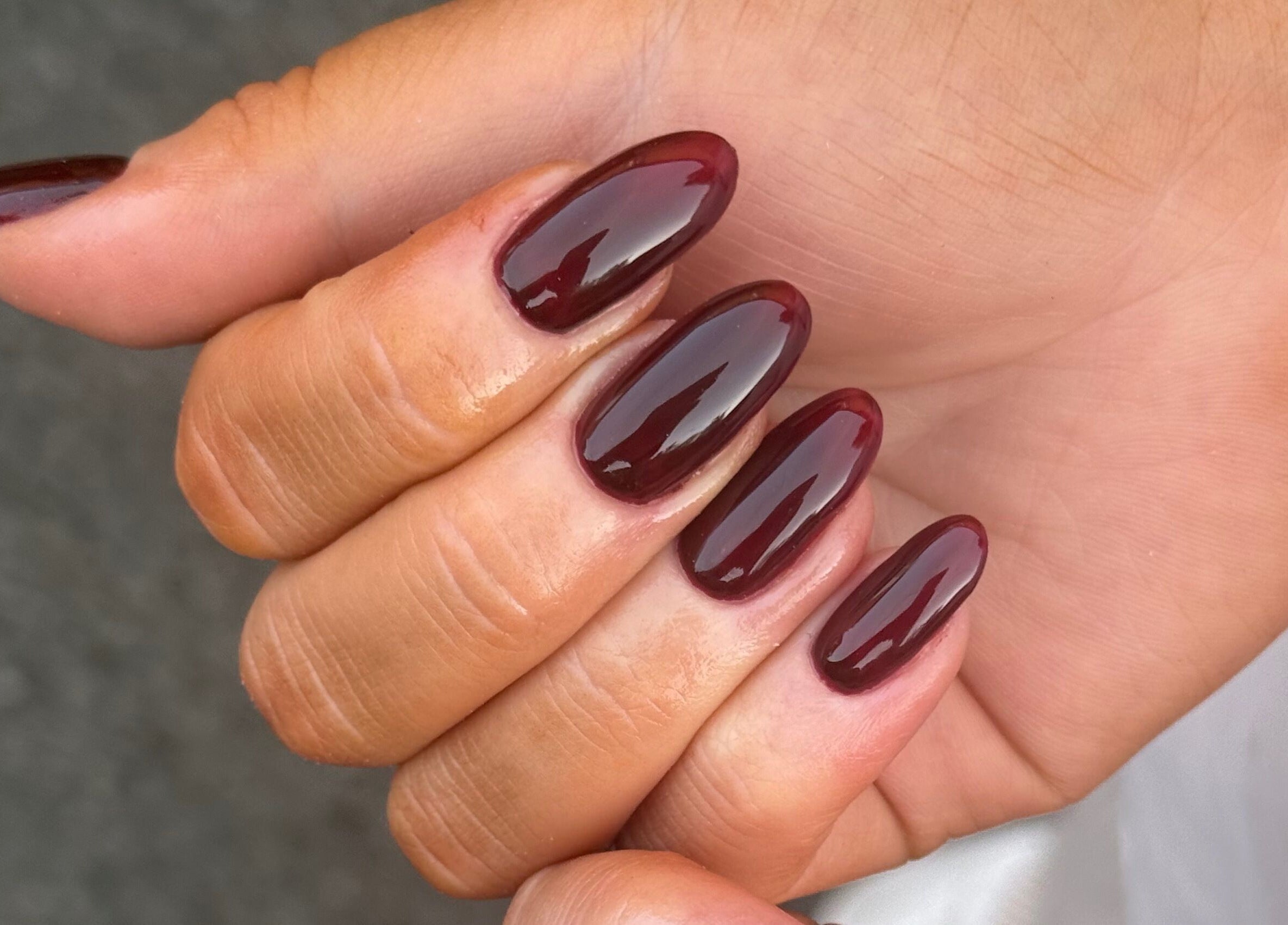 Elegant dark red nails manicured at Manicured By Amelia, Cannock, England, GB.