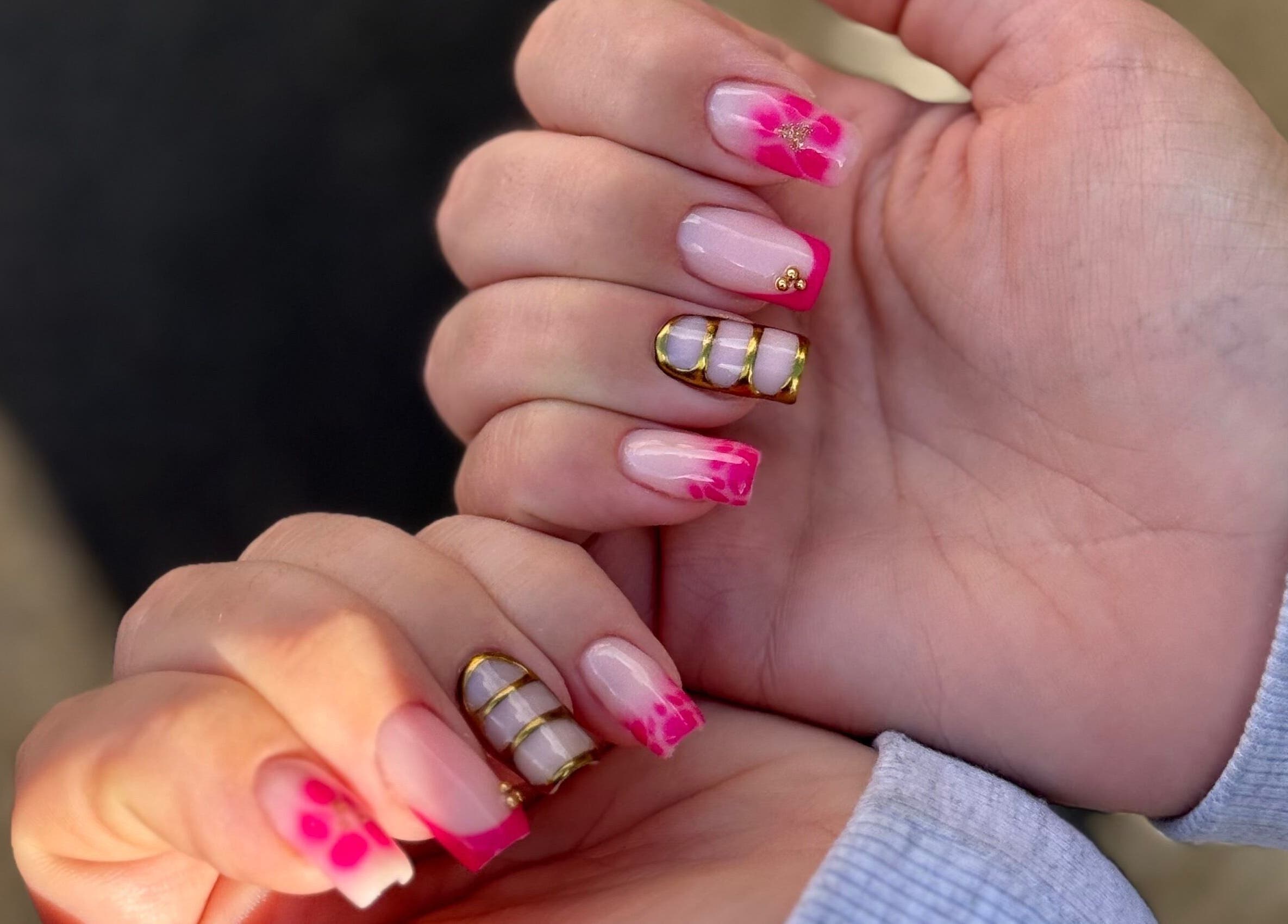 Stylish pink floral nails by Manicured By Amelia in Cannock, England, GB.