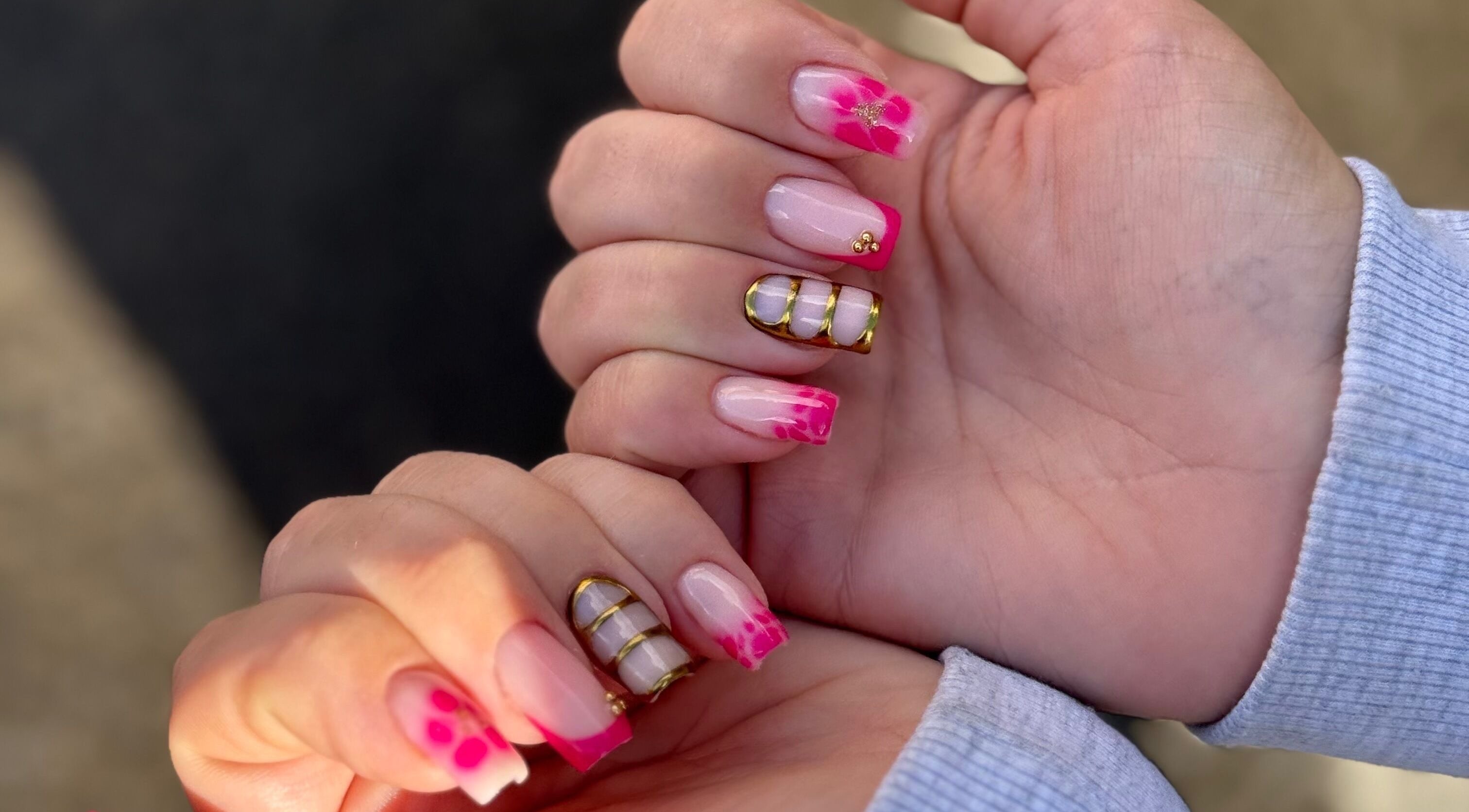 Stylish pink floral nails by Manicured By Amelia in Cannock, England, GB.
