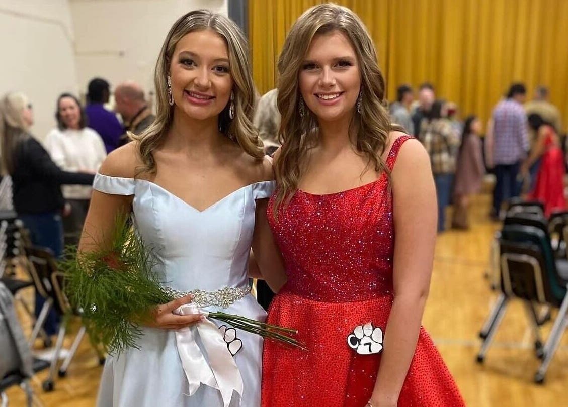 Two women in formal dresses at Bronzed Belles by Bree, LLC, Starr, South Carolina, US event.