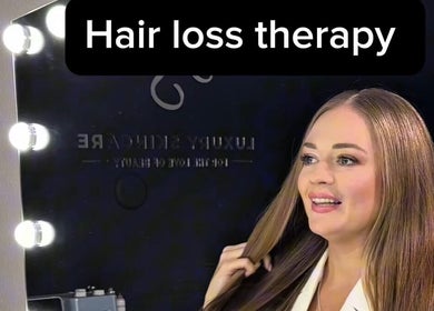 Hair loss therapy at LUXURY SKINCARE STUDIO in Bloomington, Minnesota, US shown in a glamorous salon setting.