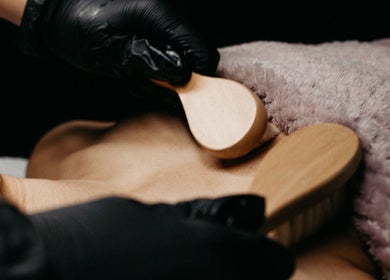 Luxurious body massage at LUXURY SKINCARE STUDIO in Bloomington, Minnesota, US, using wooden relaxation tools.