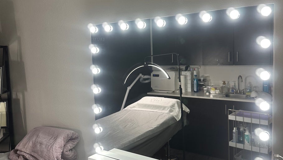 Luxury Skincare Studio in Bloomington, Minnesota, US featuring a well-lit mirror and treatment bed.