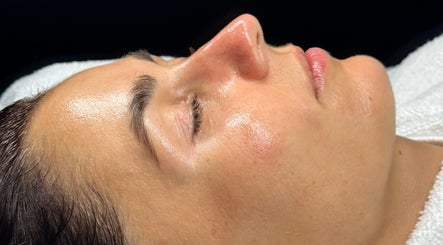 Facial treatment at Luxury Skincare Studio, Bloomington, Minnesota, US. Close-up of revitalized, glowing skin.