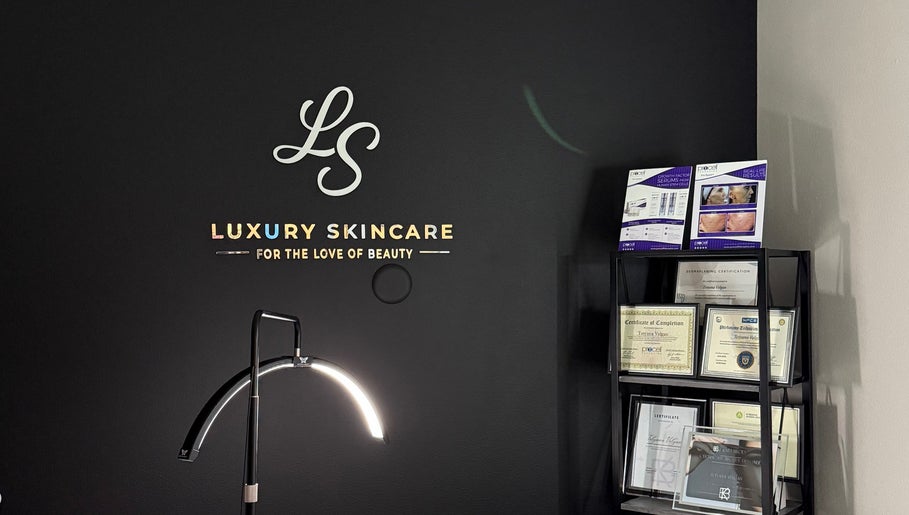 Elegant display at Luxury Skincare Studio, Bloomington, Minnesota, US, showcasing certifications and brochures.