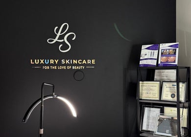 Elegant display at Luxury Skincare Studio, Bloomington, Minnesota, US, showcasing certifications and brochures.