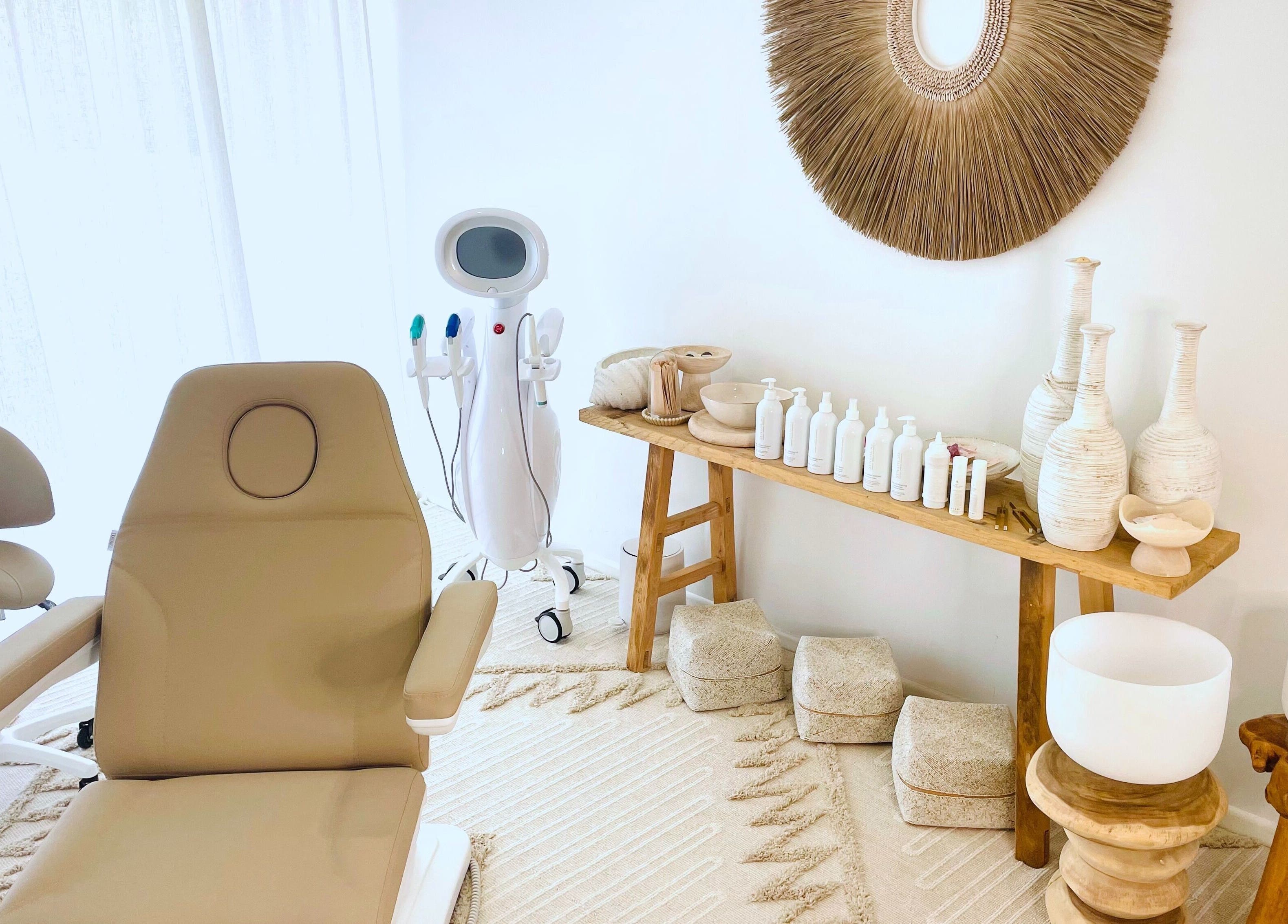 Chic spa interior at The Sound Studio, Palm Beach, Queensland, AU with cozy treatment chair and decor.