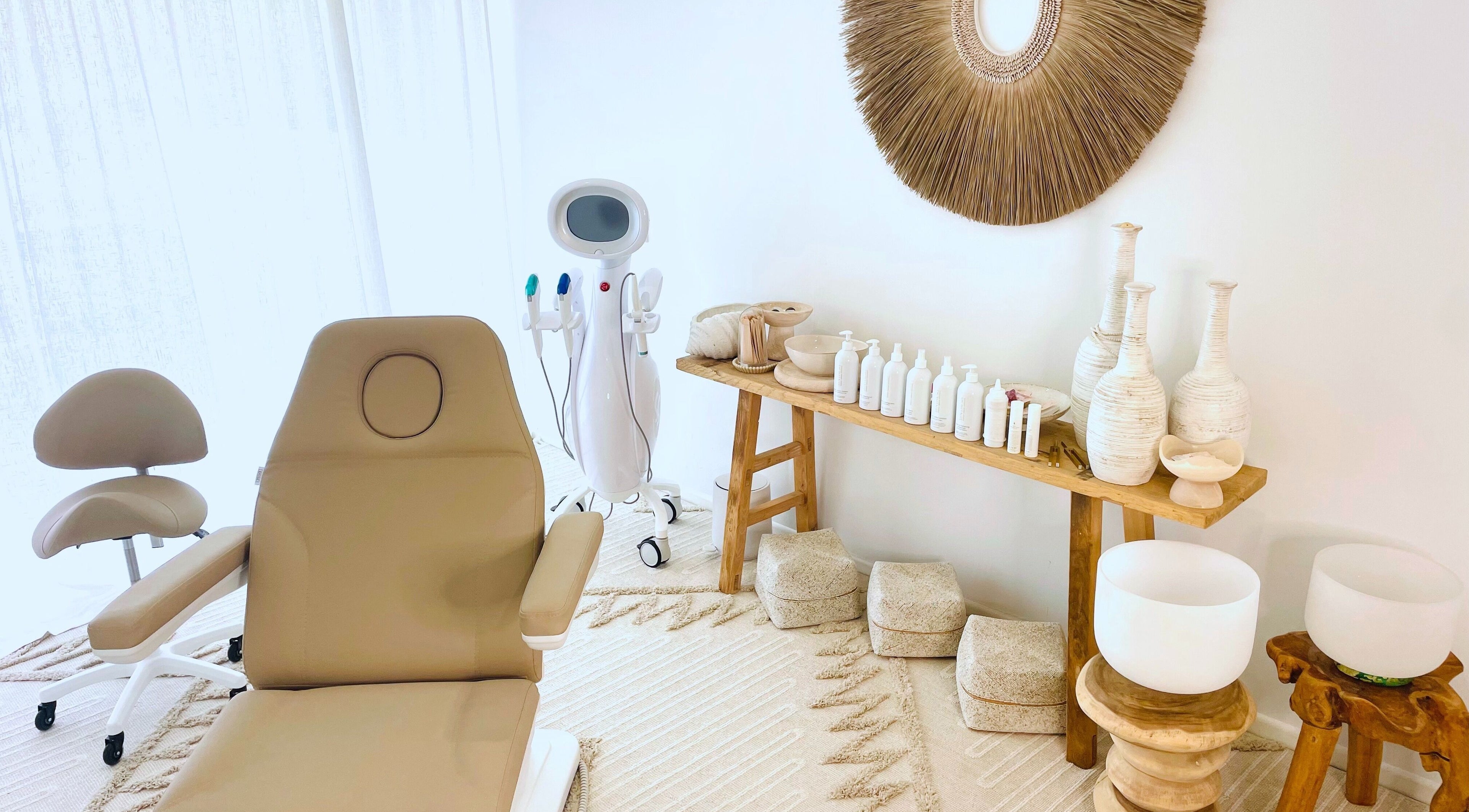 Chic spa interior at The Sound Studio, Palm Beach, Queensland, AU with cozy treatment chair and decor.