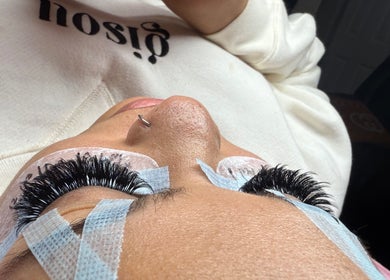 Close-up of eyelash extension process at Rose Lash Studio LLC, Hollywood, Florida, US, showing thick lashes.