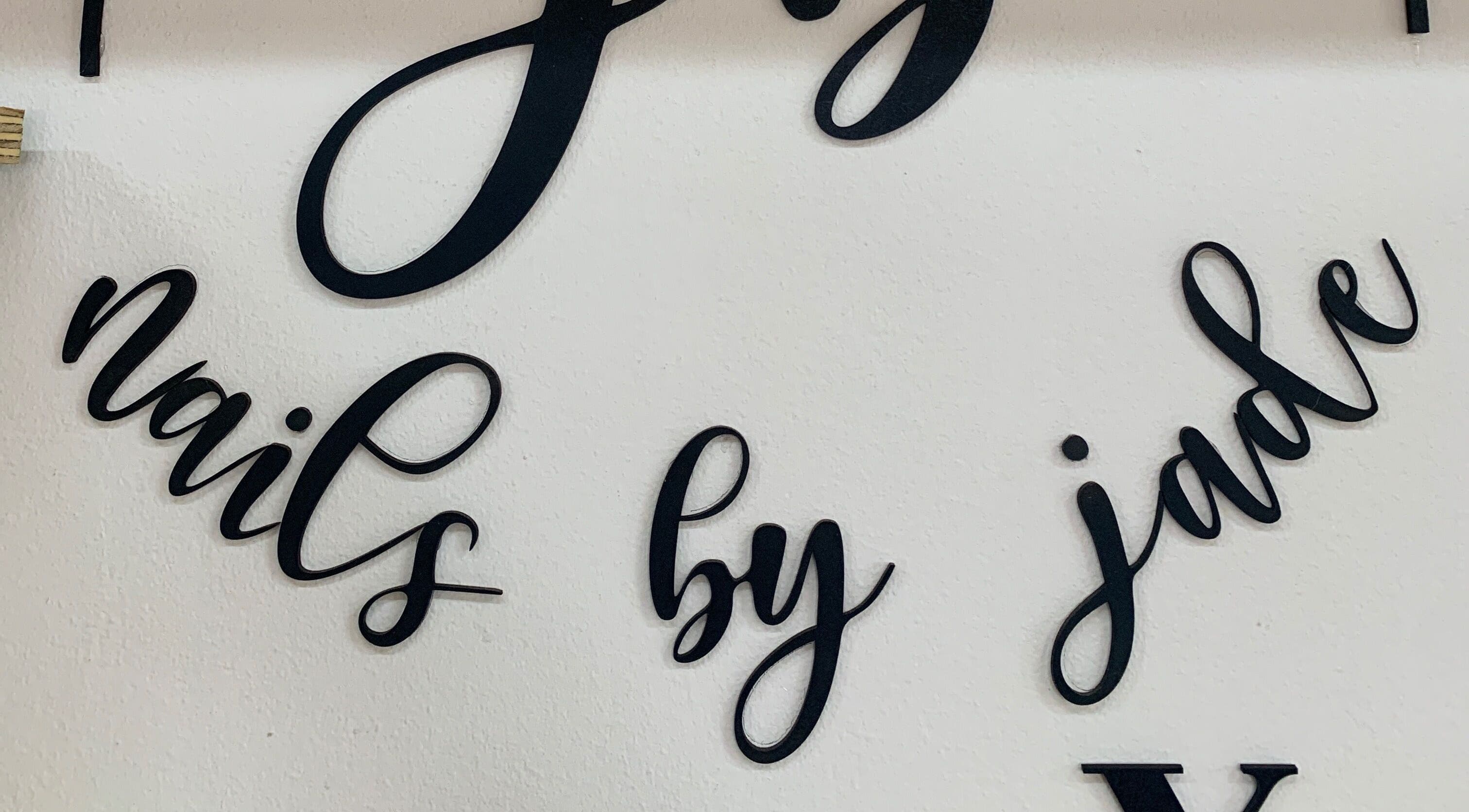 Elegant wall sign at Nails By Jade in Pietermaritzburg, Kwazulu-natal, ZA, showcasing artistic lettering.